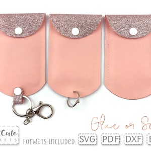 May include: Three pink leather keychains with glittery tops and white button closures. One keychain has a silver keyring and clasp attached. The image includes the text "CutCute Crafts" and "Glue or Sew". Formats included: SVG, PDF, DXF, EPS.