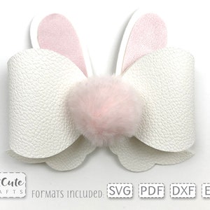 May include: White faux leather bow with pink bunny ears and a pink fluffy pom-pom in the center.  Formats included: SVG, PDF, DXF, EPS.