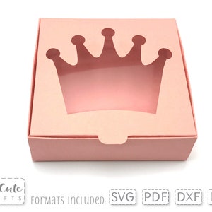 May include: A pink cardboard box with a crown-shaped cut-out window. The box is designed for packaging small gifts or favors.  Formats included: SVG, PDF, DXF, EPS.