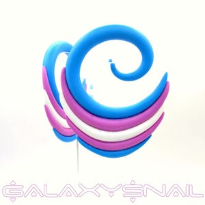 May include: Spiral-shaped earrings in blue, purple, and white. The earrings have a layered design with a curved shape. The text "GALAXY SNAIL" is at the bottom of the image.
