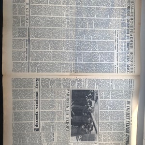 May include: A black and white newspaper page with the headline "Leninism- the inexhaustible source of revolutionary energy and creativity of the masses". The page also features a photo of a group of people in a meeting.