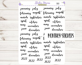 May include: A set of monthly planner stickers featuring the months of the year, January through December, with the year 2022 printed below. The stickers are white with black lettering and the words "MONTHLY STICKERS" are printed in black on a white background.