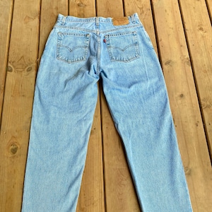 Vintage 1990s Levis 550 Relaxed Fit Tapered Leg Light Wash Jeans size 32 Paper Tag