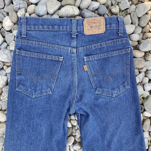 Vintage 1970s Levis Student 716-0917 Orange Tab Medium Wash Jeans Straight Leg Paper Tag Made in USA size 25 26 27