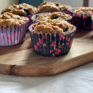 Cup cake/ muffin cases, paper rosettes, hearts for loved ones