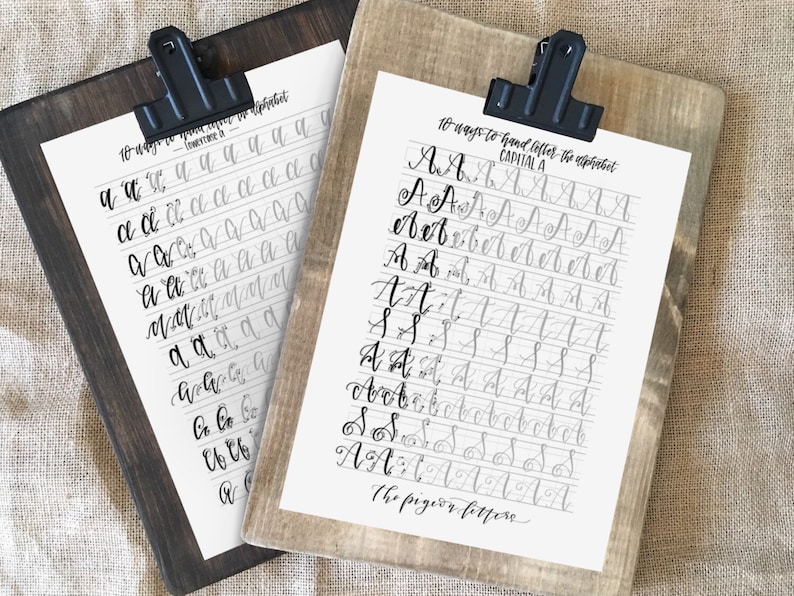 May include: Two printable worksheets for practicing calligraphy. The first sheet shows 10 ways to hand-letter the lowercase letter "a". The second sheet shows 10 ways to hand-letter the capital letter "A". The text "The pigeon letter" is at the bottom of the second sheet.