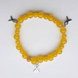 Yellow bead bracelet: yellow beads with ribbon charms, suicide awareness bracelet, mental health awareness bracelet, stretch bracelet