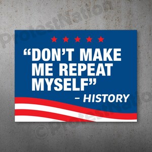 May include: A blue and white sign with the text "DON'T MAKE ME REPEAT MYSELF" and "- HISTORY". The sign has red stars and stripes, resembling a flag.
