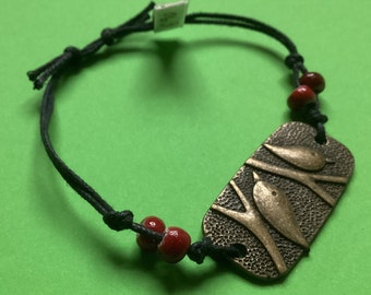 Bracelet with bronze-colored METAL RECTANGLE WITH BIRD MOTIF