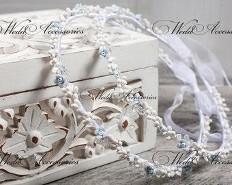 Blue stefana made with porcelain flowers in ivory and light blue colors combined with clear crystals Swarovski.