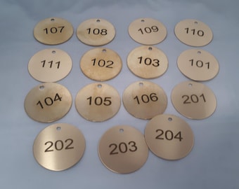 numbered BRASS tags, 1-1/2 inch,  .05" THICK with mounting hole or .02" thick for custom