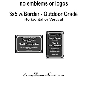 May include: Two black metal signs with a white border and white text. The signs are 3x5 inches and are for outdoor use. The text on the signs reads "Community Project Forest Preston Group 053 Trail Restoration Special thanks to Ally, Ava, Ella, Ellarie, Greta, Harlow, Lilly, Malia. Spring 2042" and "Community Project Forest Preston Group 053 Trail Restoration Special thanks to Ally, Ava, Ella, Ellarie, Greta, Harlow, Lilly, Malia. Spring 2024".