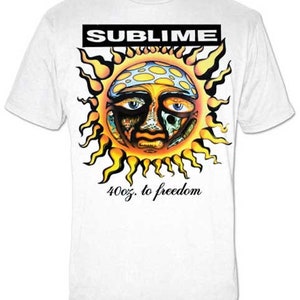 May include: White t-shirt with a graphic of a yellow sun with a face and the text "Sublime" and "40oz. to freedom".