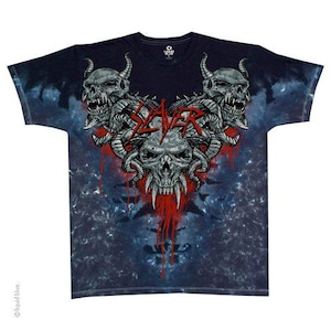May include: Black and blue tie-dye t-shirt featuring a graphic design with three skulls, horns, and the word "SLAYER" in red. The skulls have sharp teeth and are surrounded by red blood-like splatters. The shirt is a short-sleeved crew neck.