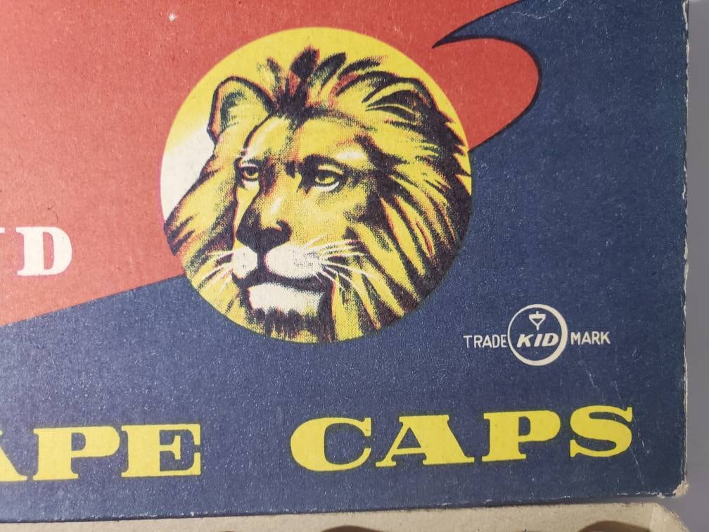 Vintage Lion Brand Firing Tape Caps Display with 21 Packs RARE Pretend