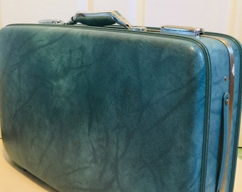 american tourister round suitcase