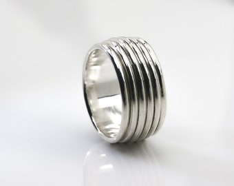 Revolutions: A Bold and Elegant Sterling Silver Ring with Six Loops