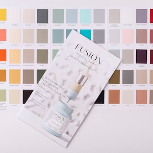 May include: A color chart for Fusion Mineral Paint, showing a variety of colors in small squares. The chart includes a paintbrush and a bottle of paint. The text on the chart reads "Fusion Mineral Paint, paint it beautiful." and "Built-in top coat, easy to apply, excellent coverage."