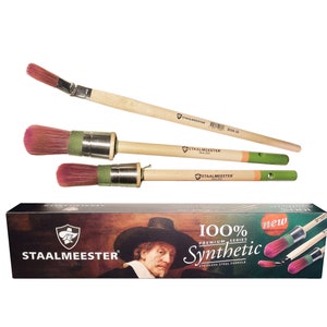 May include: A set of three paint brushes with wooden handles and green and pink bristles. The brushes are packaged in a box with the brand name "STAALMEESTER" and the text "100% Premium Series Synthetic".