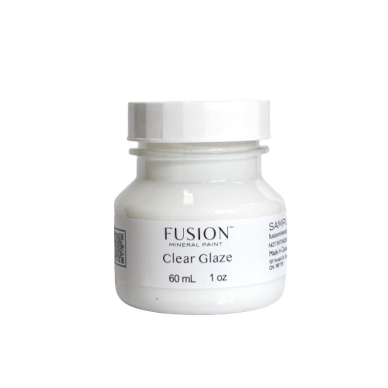 May include: A white bottle of Fusion Mineral Paint Clear Glaze. The bottle is labeled with the brand name, product name, and size: 60 mL (1 oz).