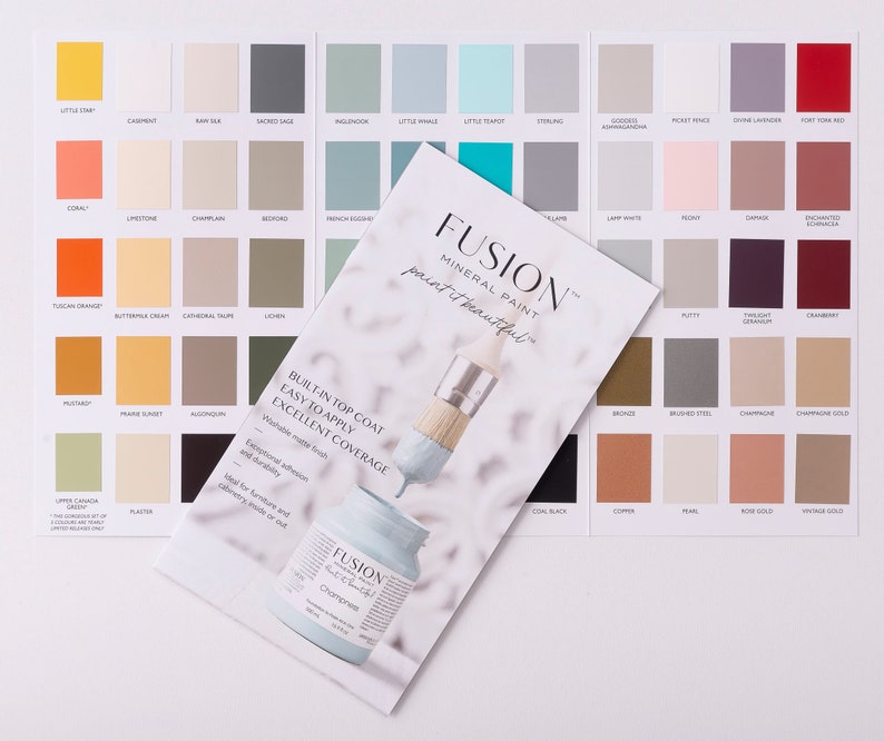 May include: A color chart for Fusion Mineral Paint, showing a variety of colors in small squares. The chart includes a paintbrush and a bottle of paint. The text on the chart reads "Fusion Mineral Paint, paint it beautiful." and "Built-in top coat, easy to apply, excellent coverage."