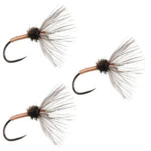 May include: Three fishing flies with black hooks, copper-colored wire bodies, dark brown heads, and gray feather wings. The flies are designed for angling.