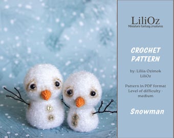 May include: Two handmade crochet snowmen with black twig arms, orange noses, and button details. The snowmen are white with black eyes. The image includes text that says "CROCHET PATTERN" and "Snowman".