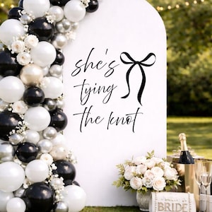 Bow bridal shower welcome decal with She’s Tying the Knot design