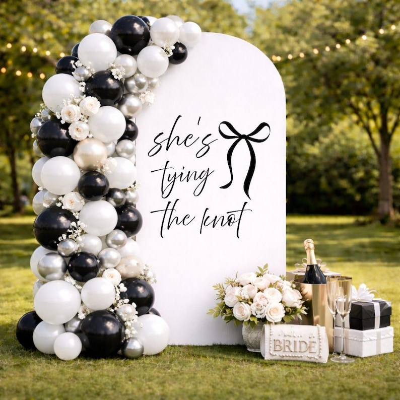 Bow bridal shower welcome decal with She’s Tying the Knot design
