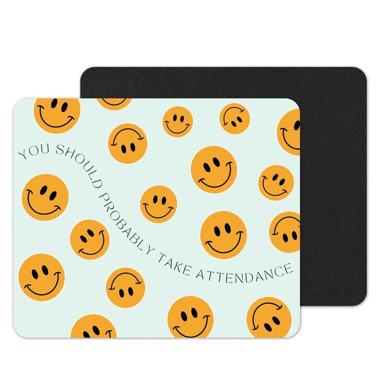 May include: A light blue mouse mat with a repeating pattern of yellow smiley faces. The text "You should probably take attendance" is written in a curved line on the mouse mat.