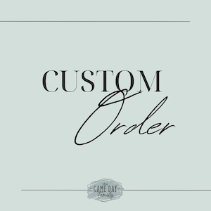 May include: A graphic design with the text "CUSTOM Order" in black text with a handwritten script style "Order" in black. The text is on a light blue background with a small logo at the bottom that says "the GAME DAY family" in black text on a white background with a gray textured border.