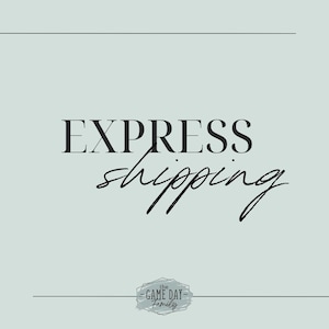 May include: A graphic with the text "EXPRESS shipping" in black text on a light blue background. The text "EXPRESS" is in a bold, sans-serif font. The word "shipping" is in a handwritten script font. Below the text is a small, gray, distressed-looking stamp with the text "the GAME DAY family".
