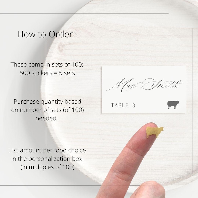 May include: A rectangular white place card featuring the name Max Smith in black script, the text TABLE 3, and a small black cow silhouette. A tiny gold cow sticker is shown separately. Text instructions explain ordering in sets of 100 stickers.