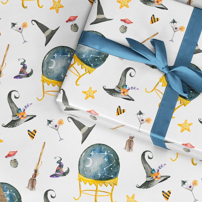 May include: White wrapping paper with a repeating pattern of witch hats, stars, crystal balls, brooms, and other Halloween-themed imagery. The paper is wrapped around a gift box with a blue ribbon.