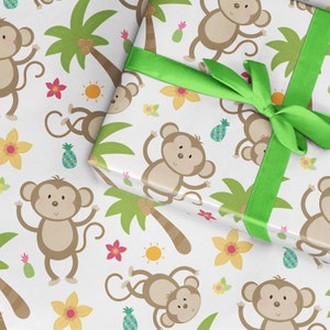 May include: White wrapping paper with a repeating pattern of monkeys, palm trees, pineapples, flowers, and suns. A green ribbon is tied around the paper.