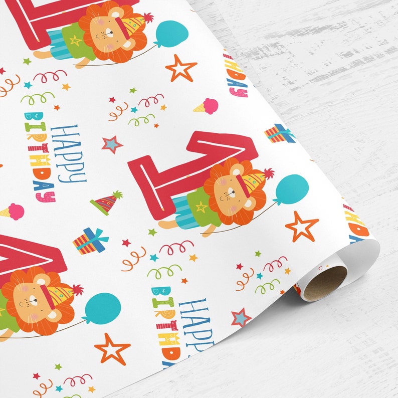 May include: White wrapping paper with a repeating pattern of a red number one, a lion wearing a party hat, stars, confetti, and the words "Happy Birthday".