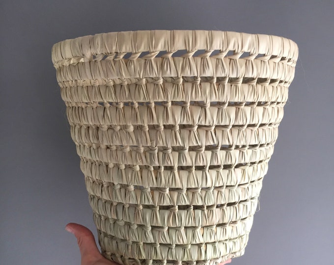 Woven waste paper basket / plant pot