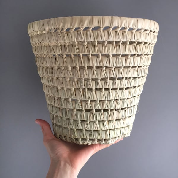 Woven waste paper basket / plant pot