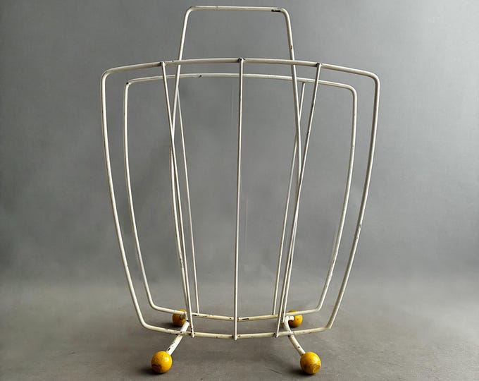 1960/50s white wire magazine rack with yellow ball feet