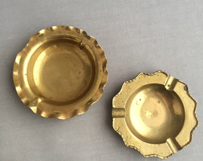 set of brass ashtrays