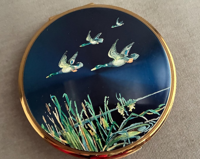 A vintage Stratton Flying Ducks powder compact
