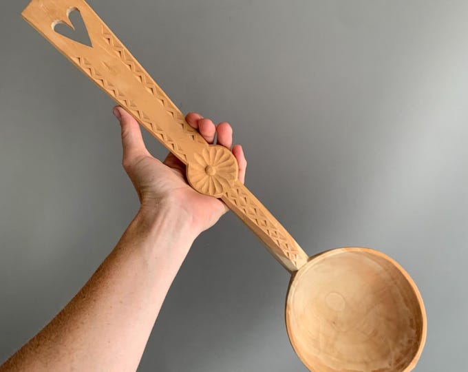 large hand carved wooden spoon