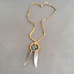 Navajo crafted suede medicine wheel pendant