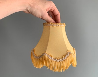 pair of little tasseled  lampshades