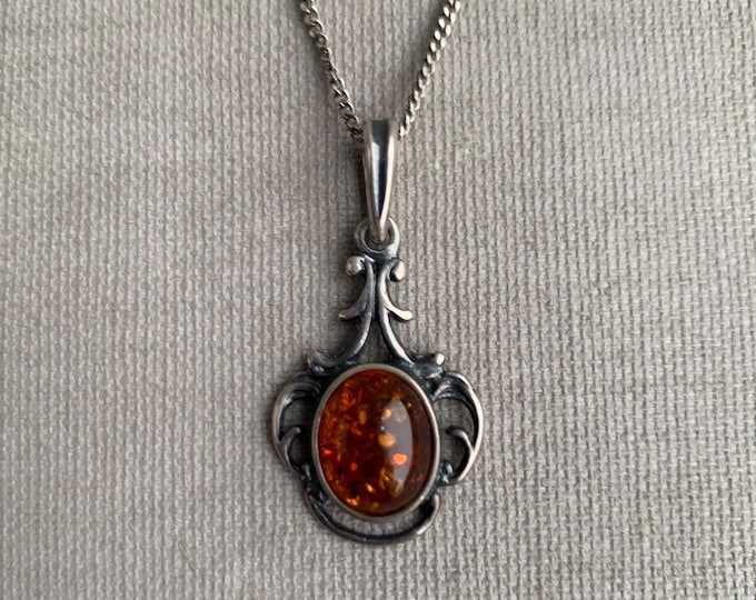 Amber and silver pendant on chain