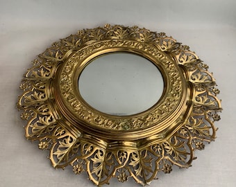 Ornate brass mirror