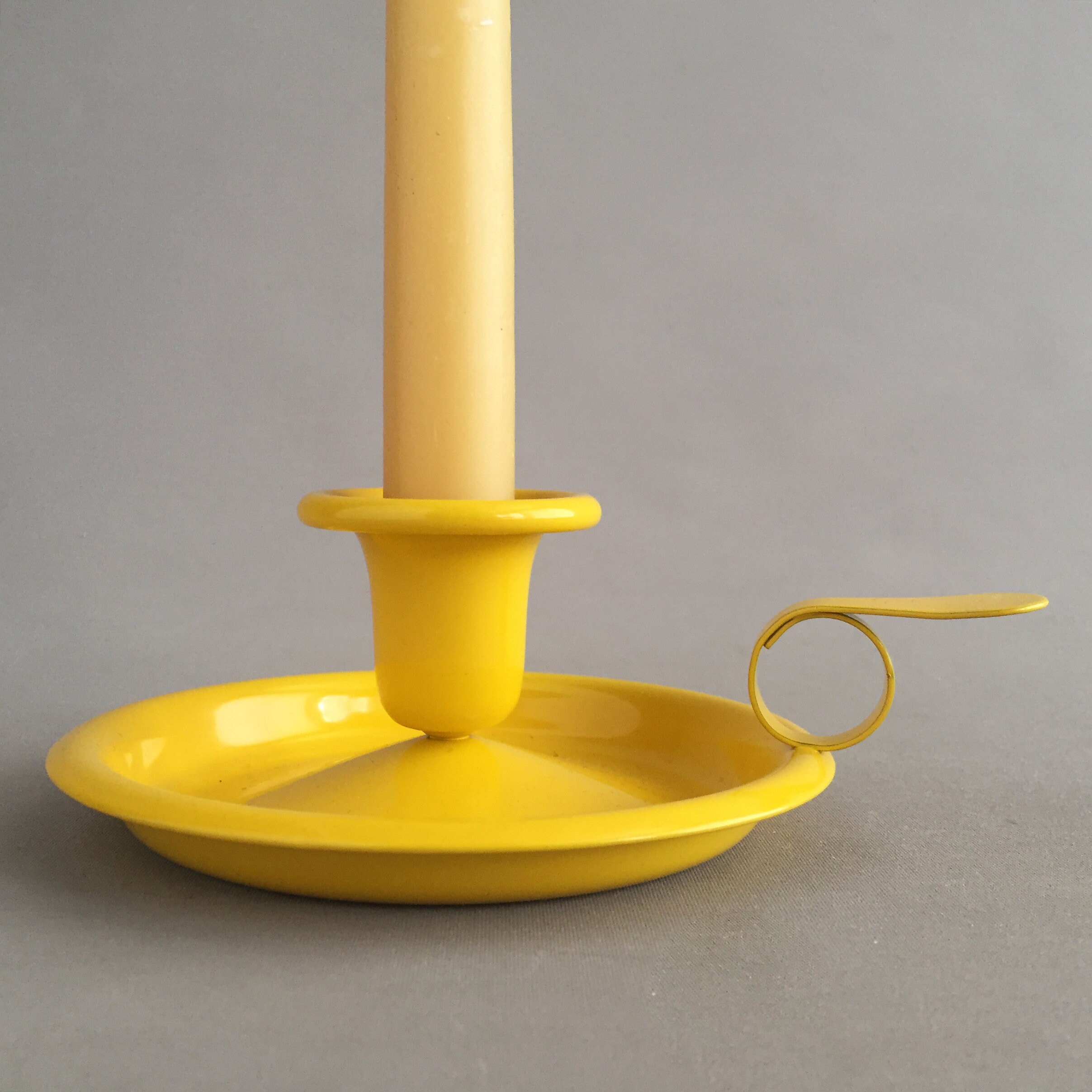 Yellow enamel candlestick holder