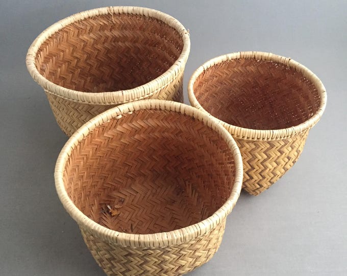Trio of woven bamboo baskets