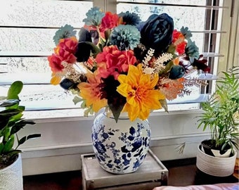 Stunning Blue Orange Red Yellow Floral Arrangement in Classic Blue and White Ginger Jar Arrangement