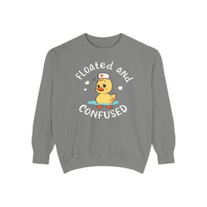May include: Grey sweatshirt with a cartoon duck wearing a nurse's hat and the text "Floated and Confused".